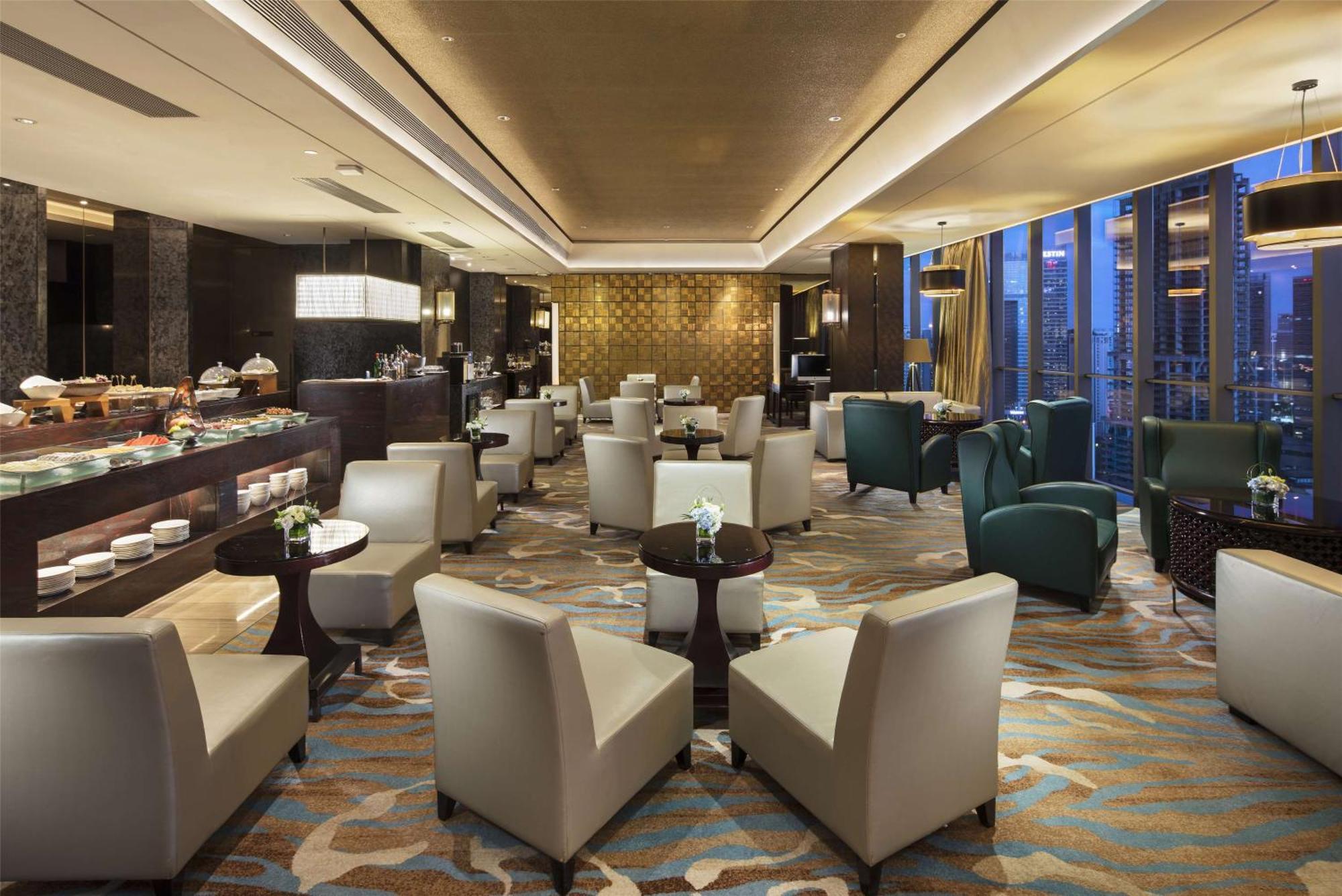 فندق هيلتون قوانغتشو تيانهي المظهر الخارجي الصورة The Club lounge at Beijing Capital International Airport